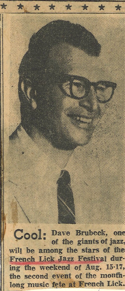 a man wearing glasses and a tie