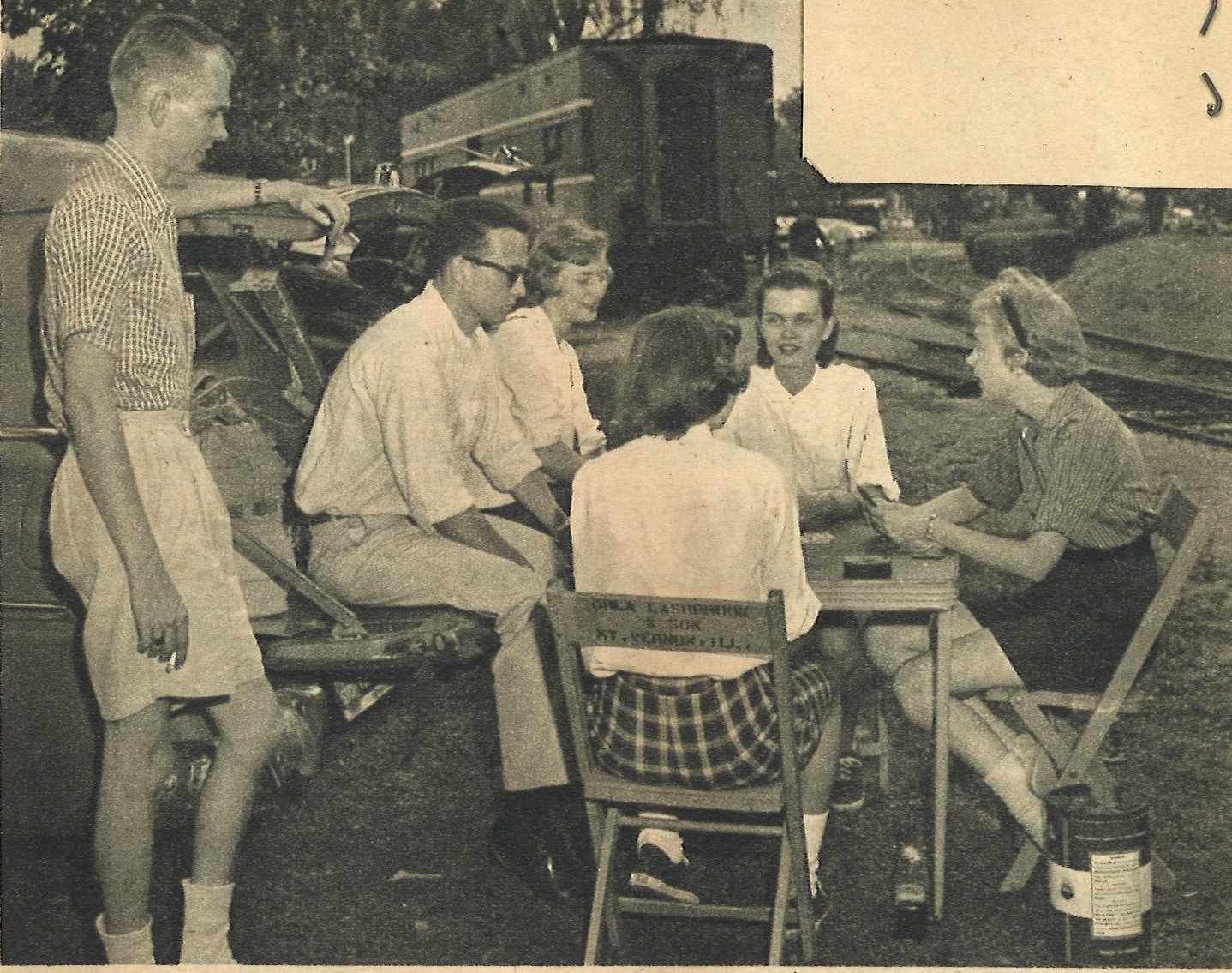 a group of people sitting around a table