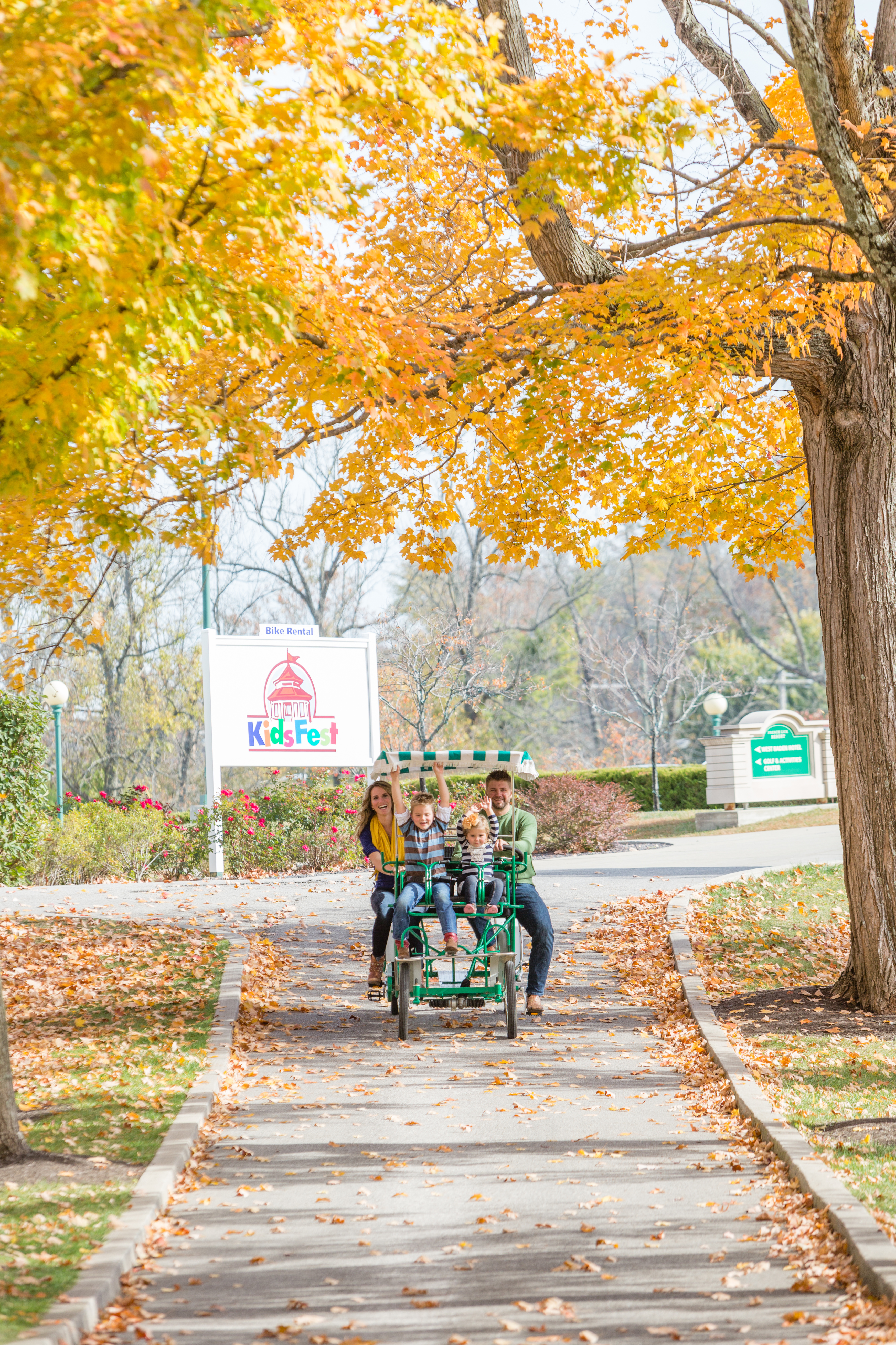 a group of people riding a cart