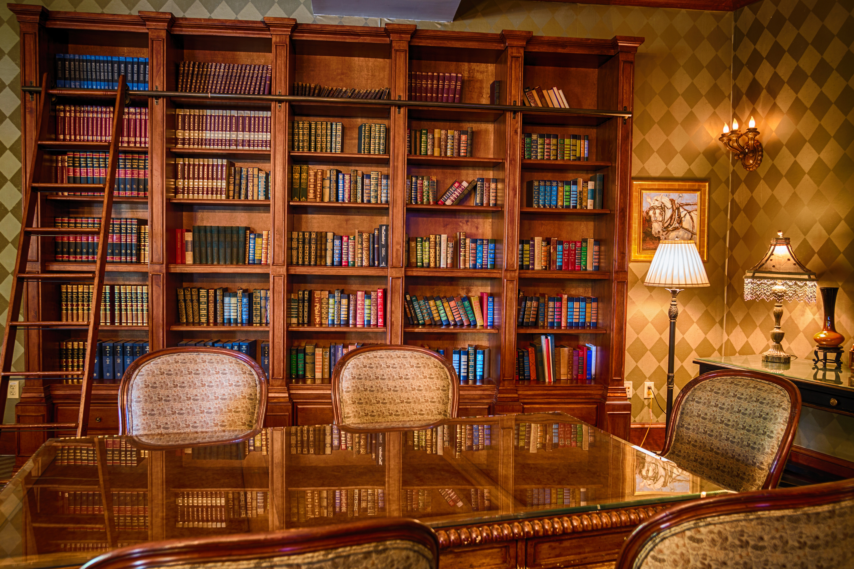 a room with bookshelves and a table