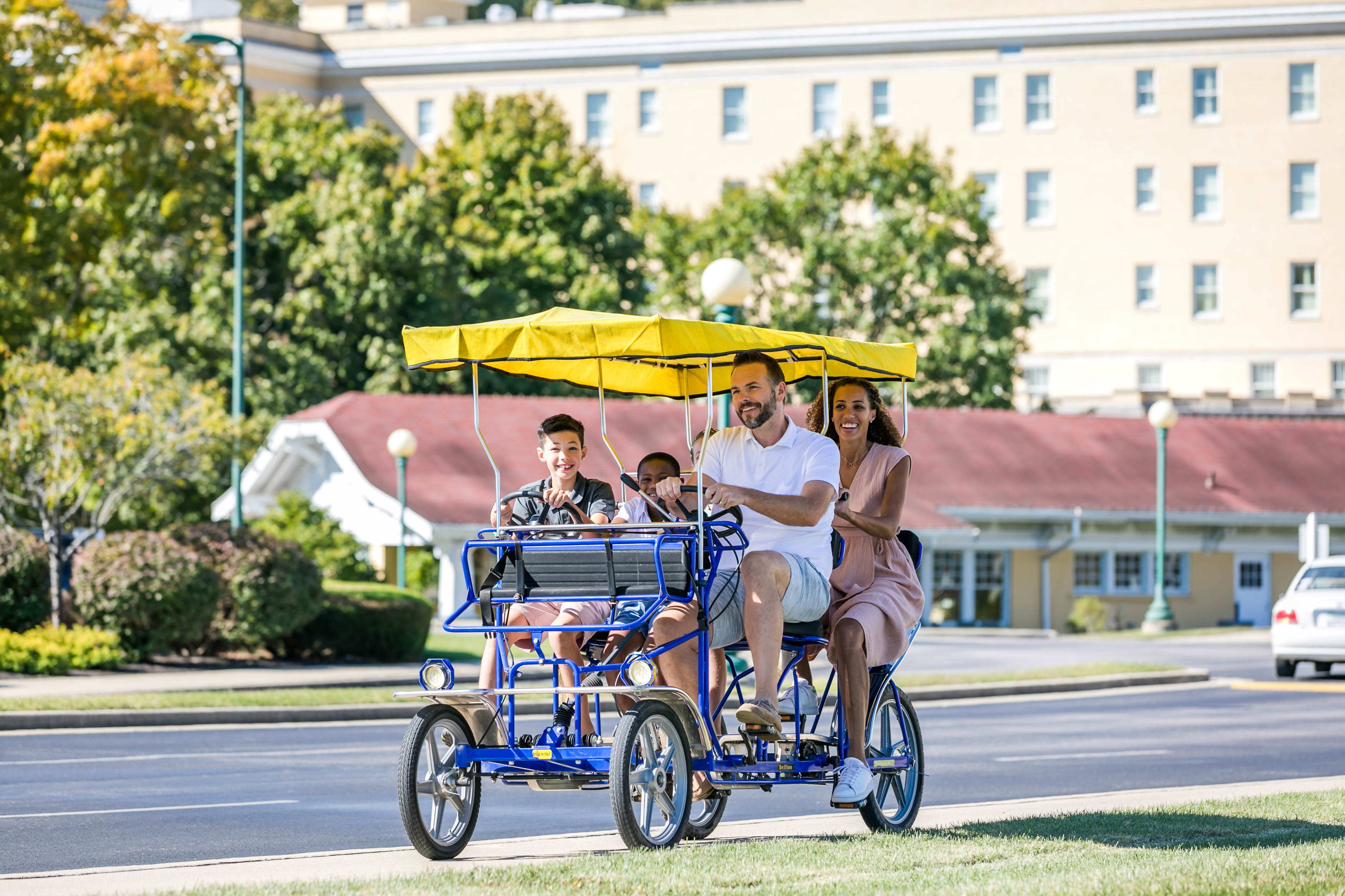 a group of people riding a bicycle