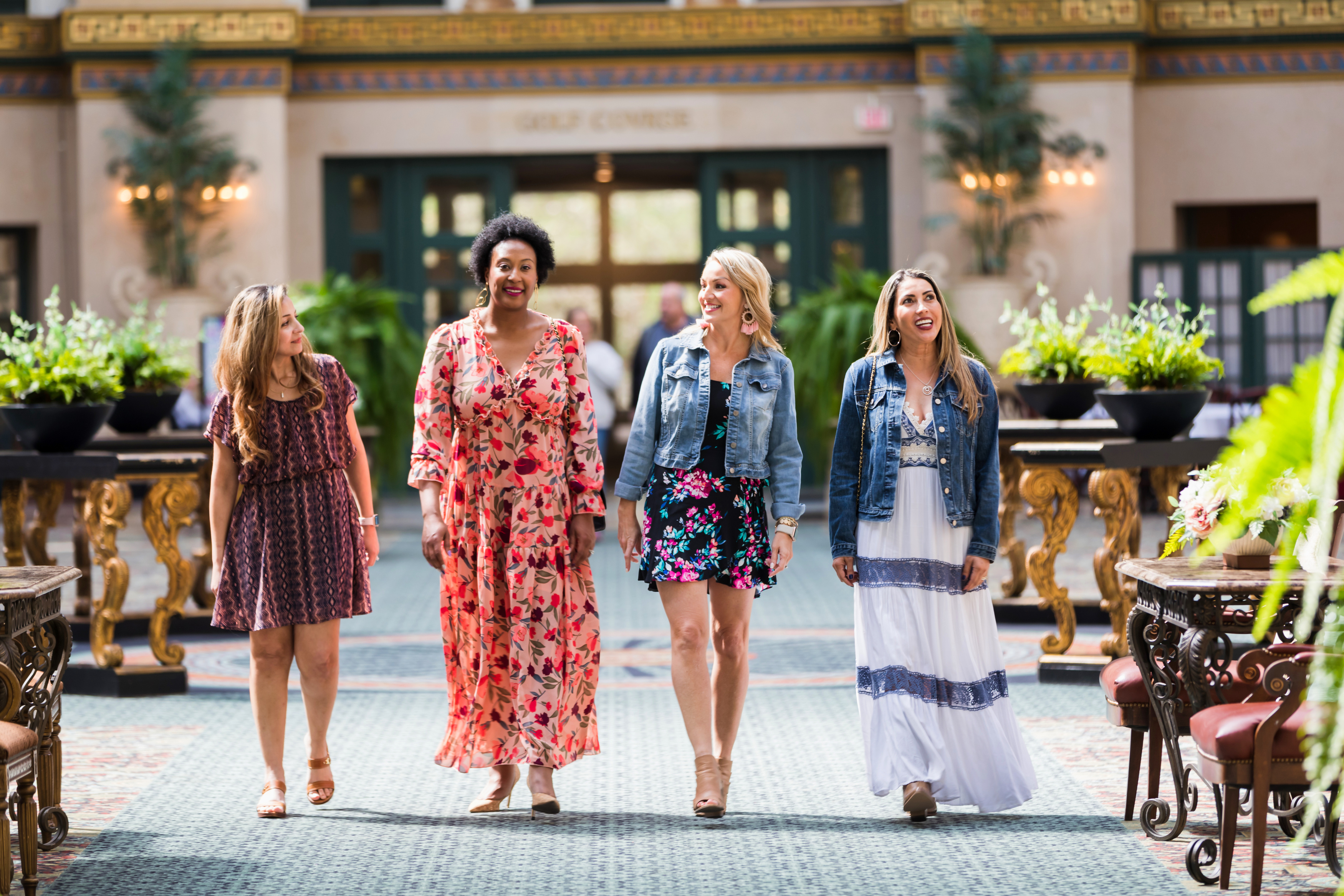 a group of women walking in a room