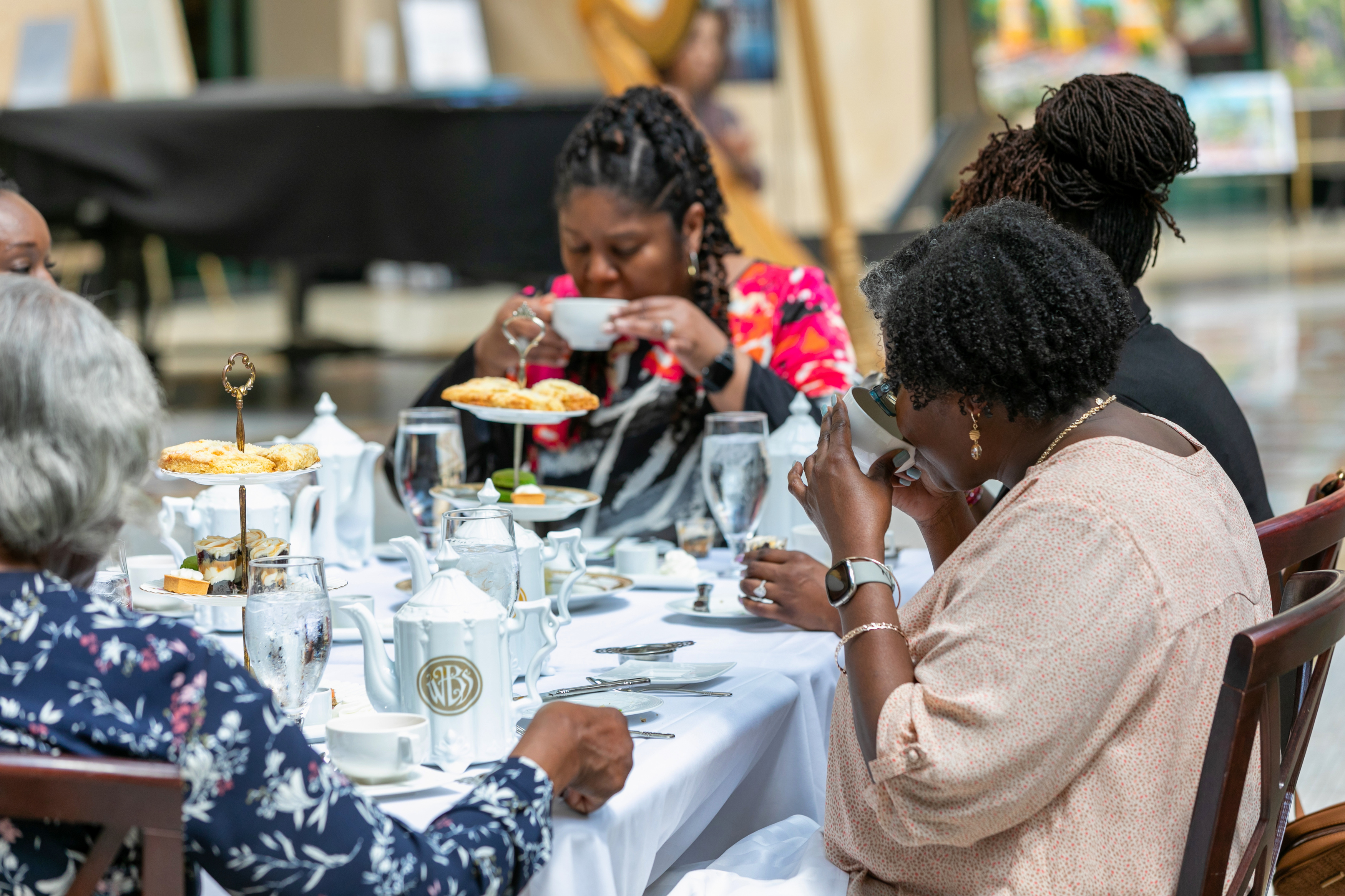 a group of people sitting at a table eating food