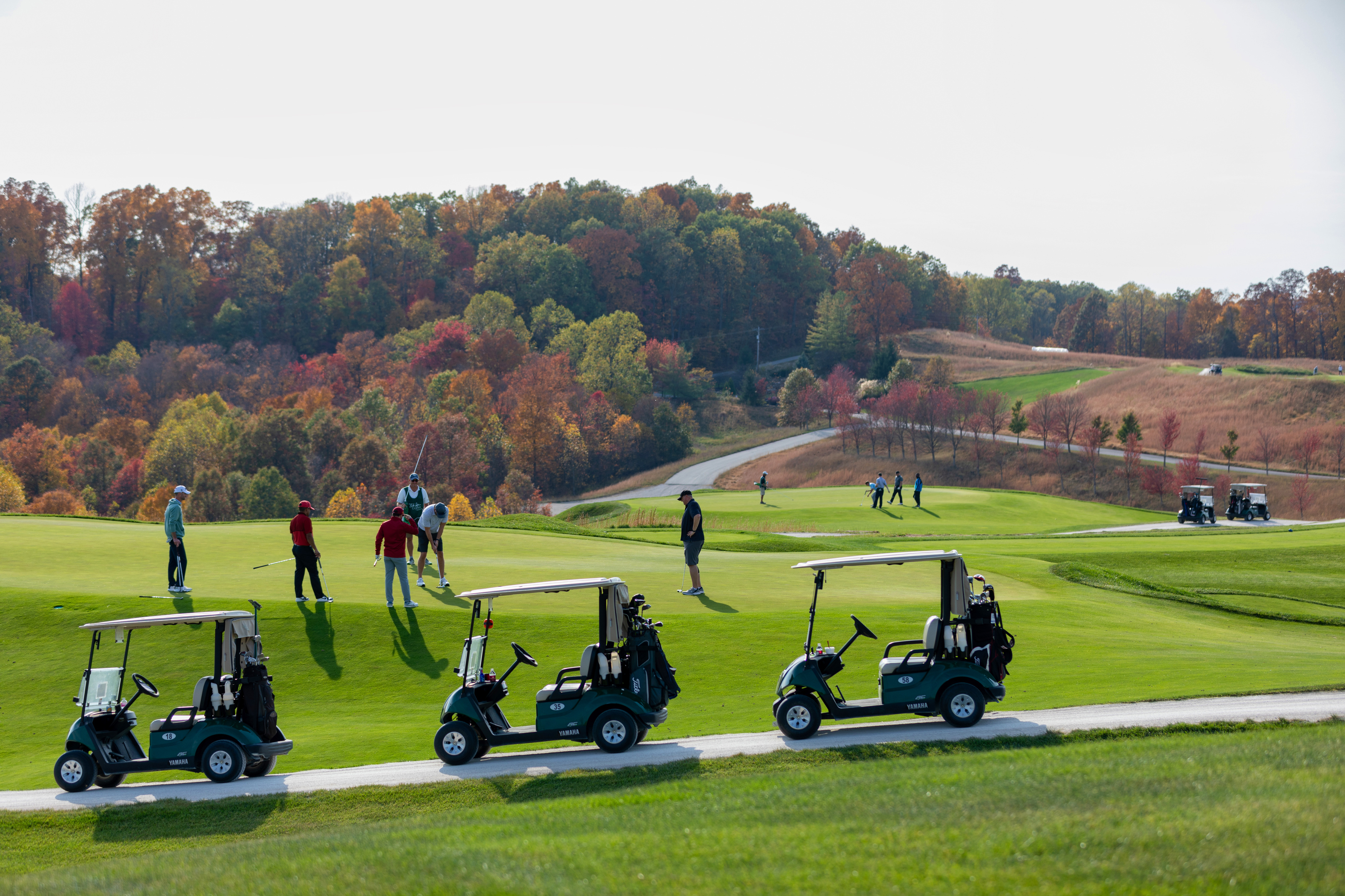 a group of people on a golf course