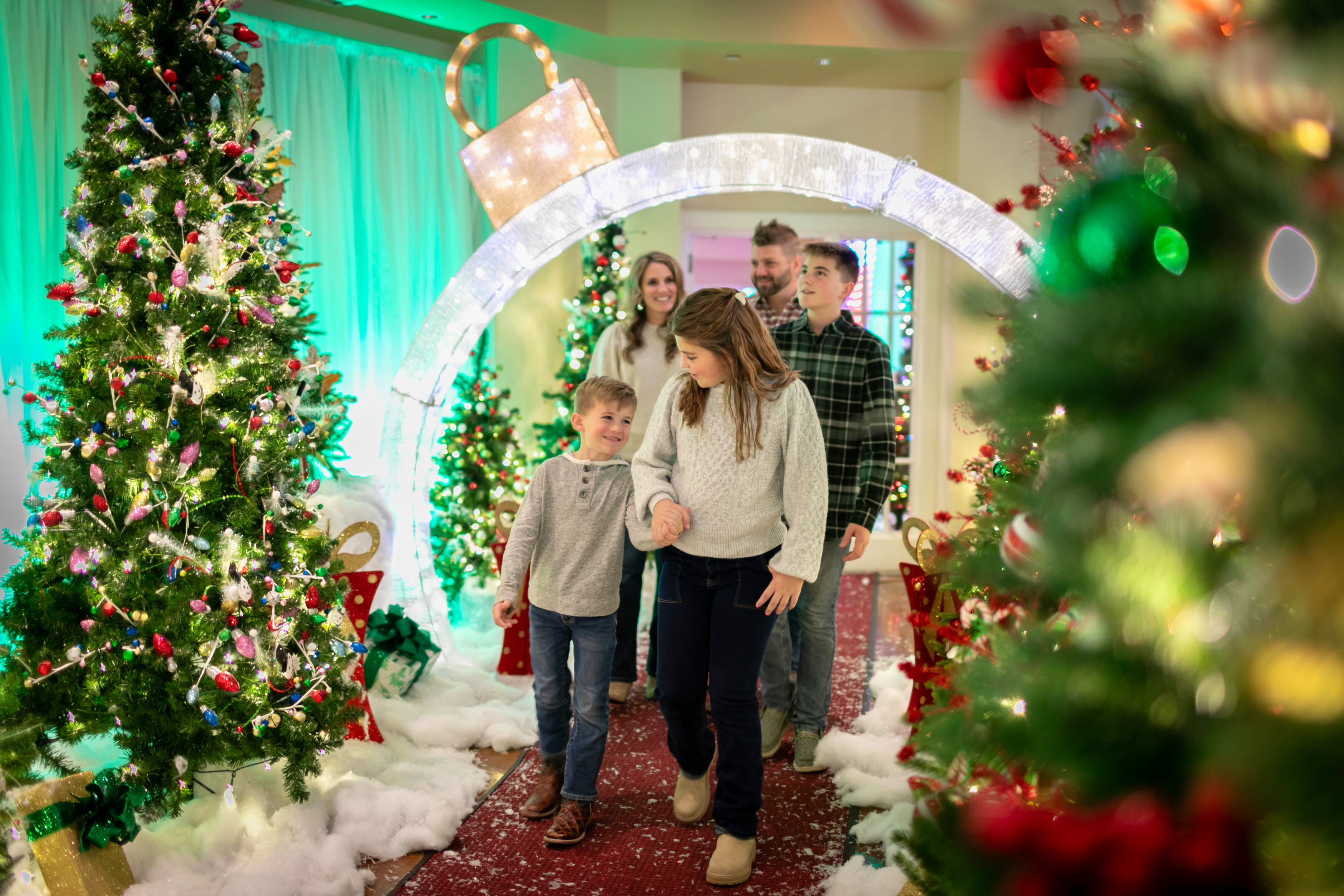 a group of people walking through a decorated room