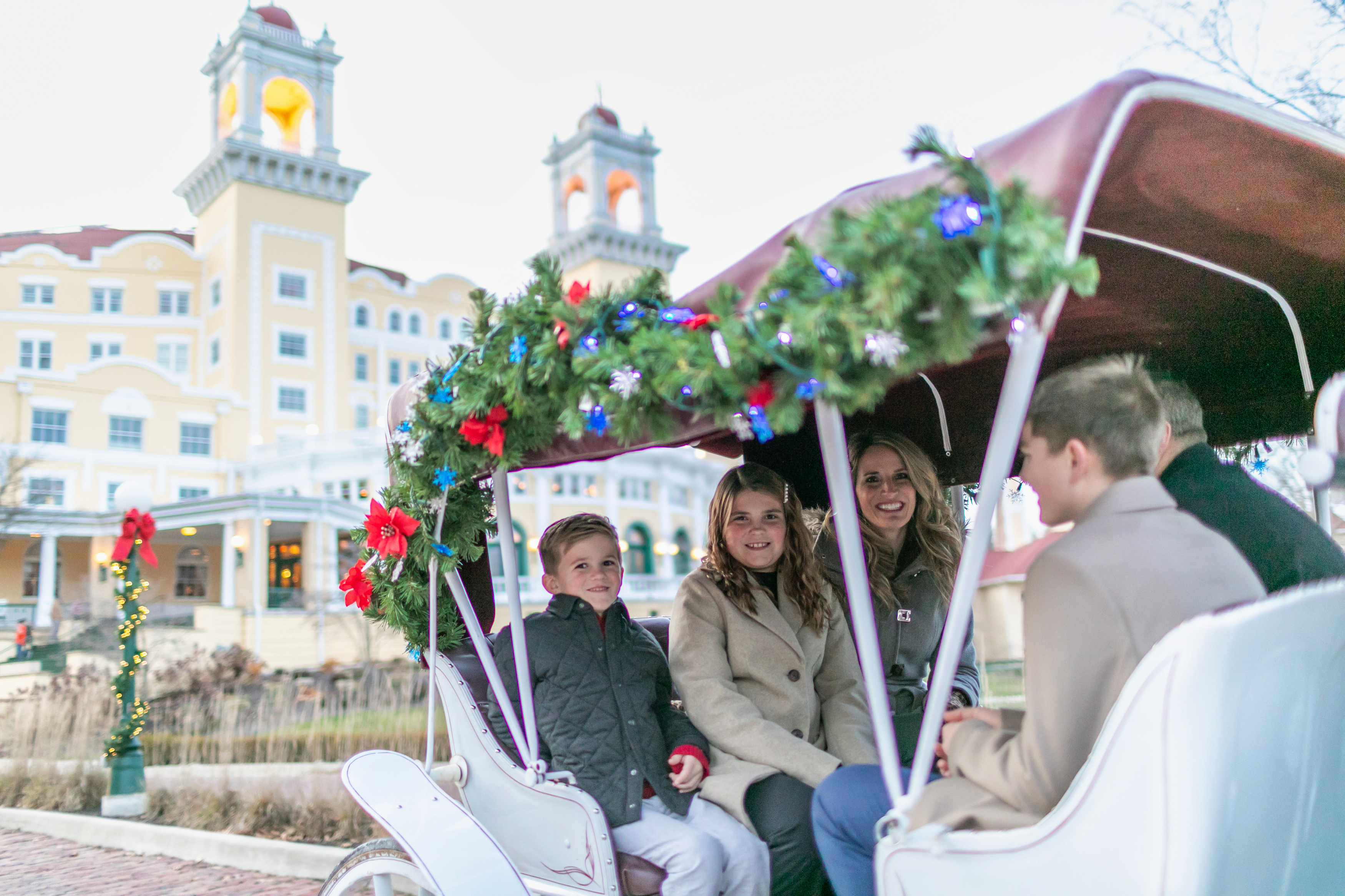 a group of people sitting in a carriage