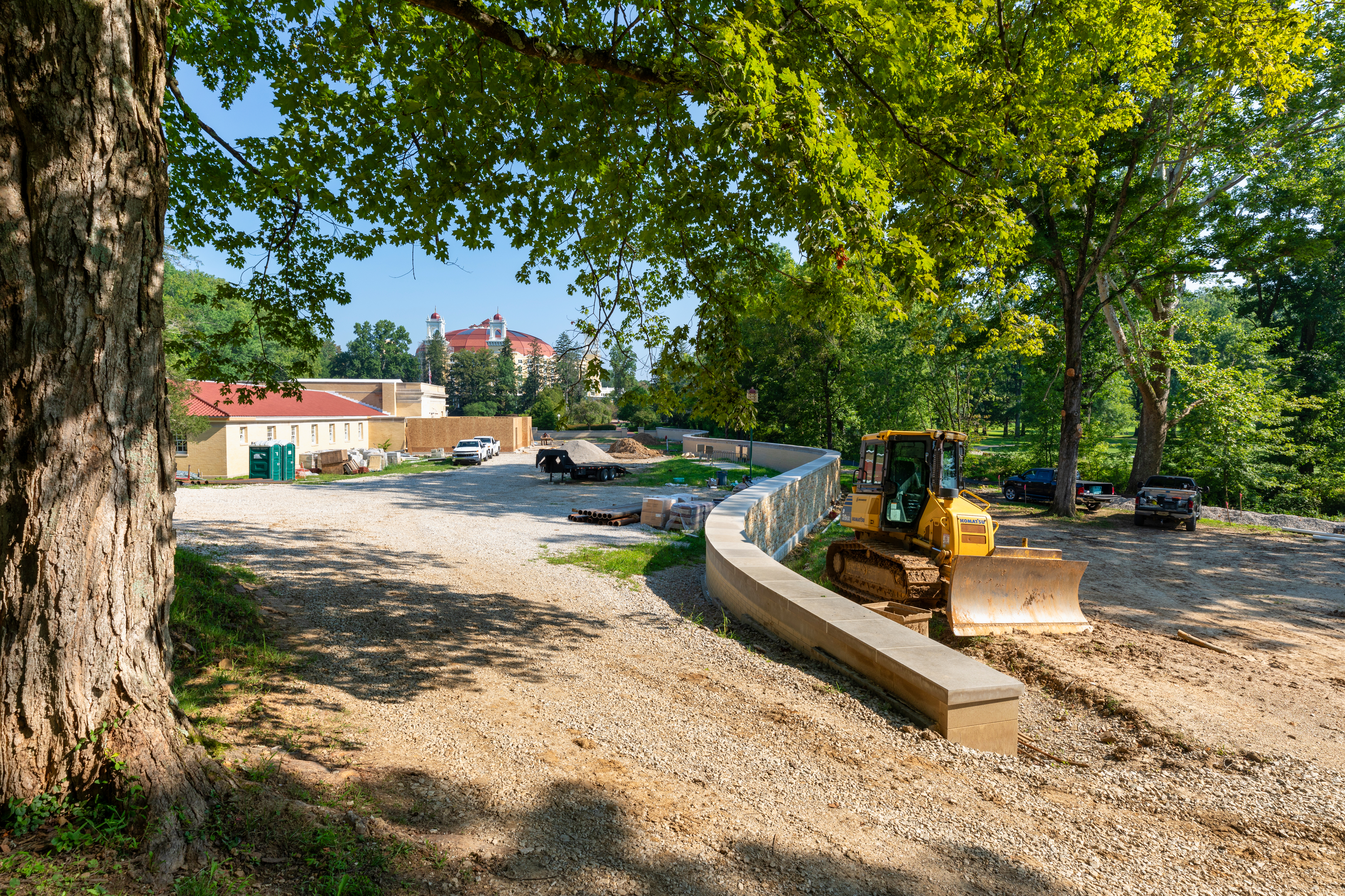 a construction site with a bulldozer and a road