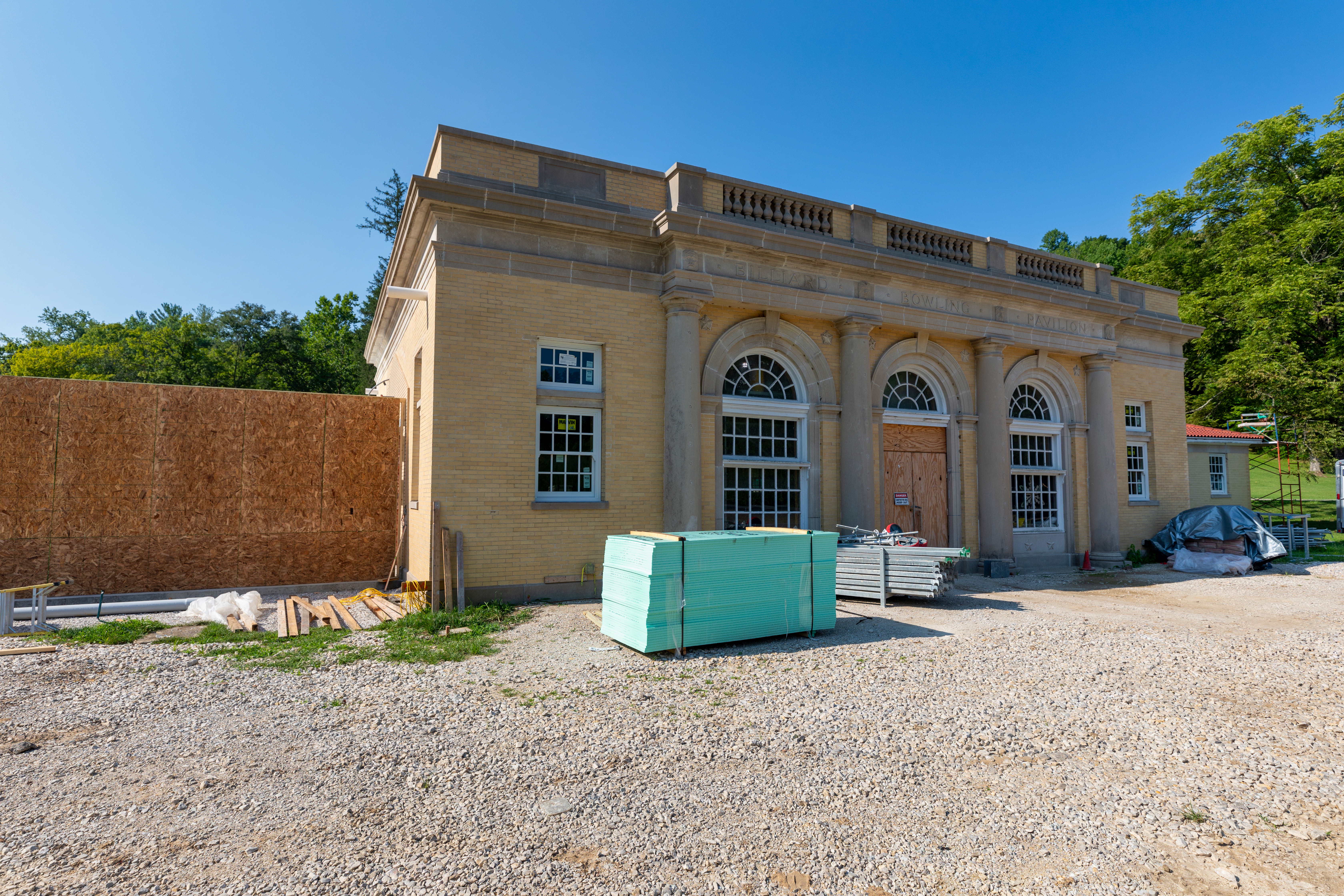 a building under construction with a fence