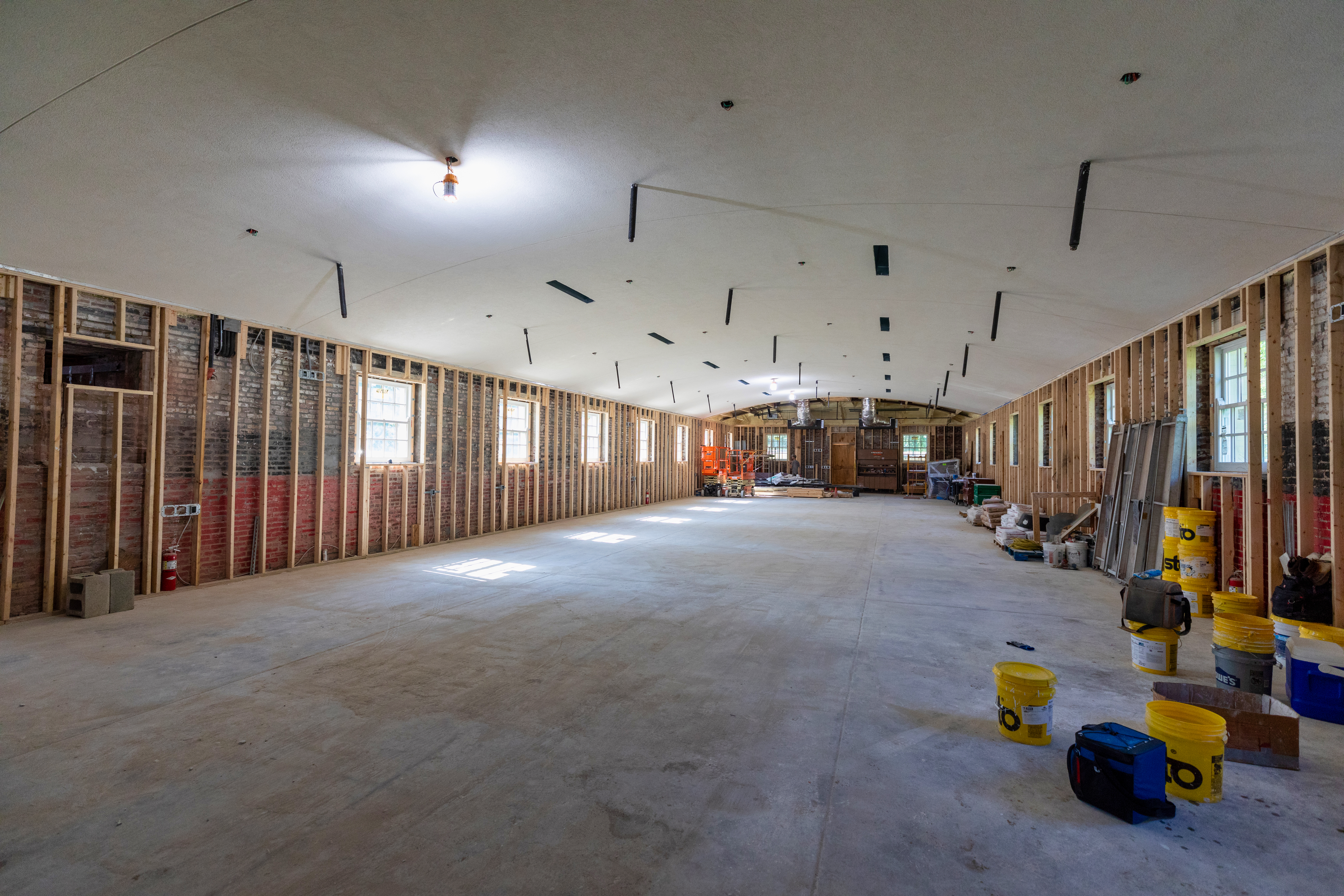 a room with a large ceiling and a few buckets