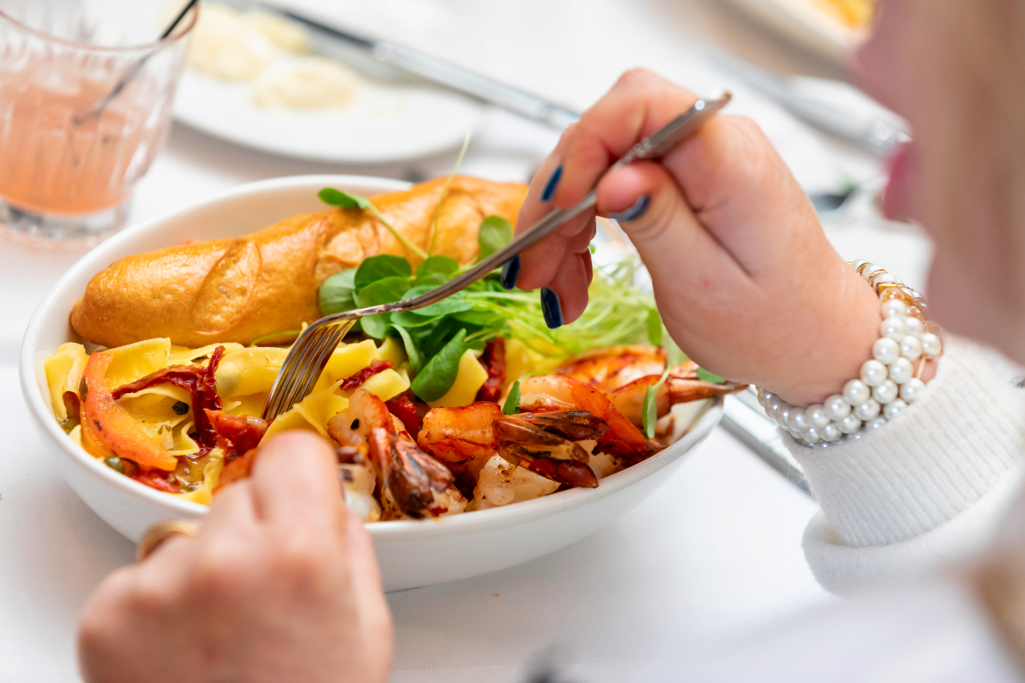 a person eating a bowl of food