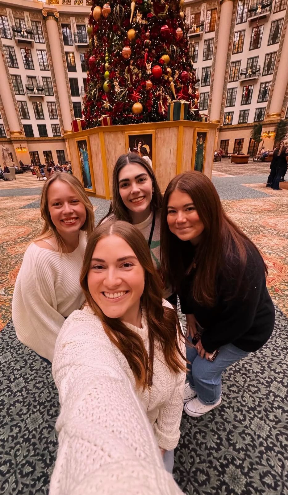 a group of women posing for a selfie