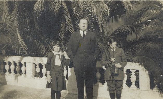 a man and two children standing next to each other