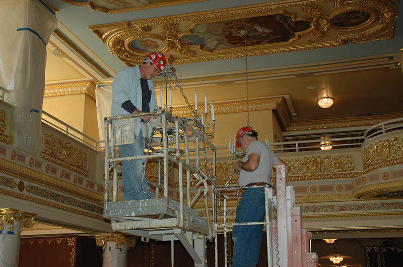 a group of men working on a scaffolding