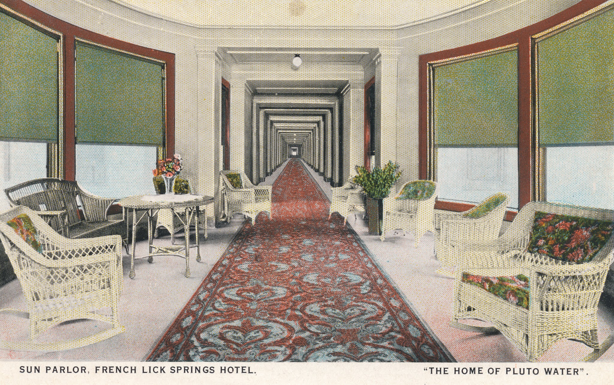 a long hallway with chairs and tables