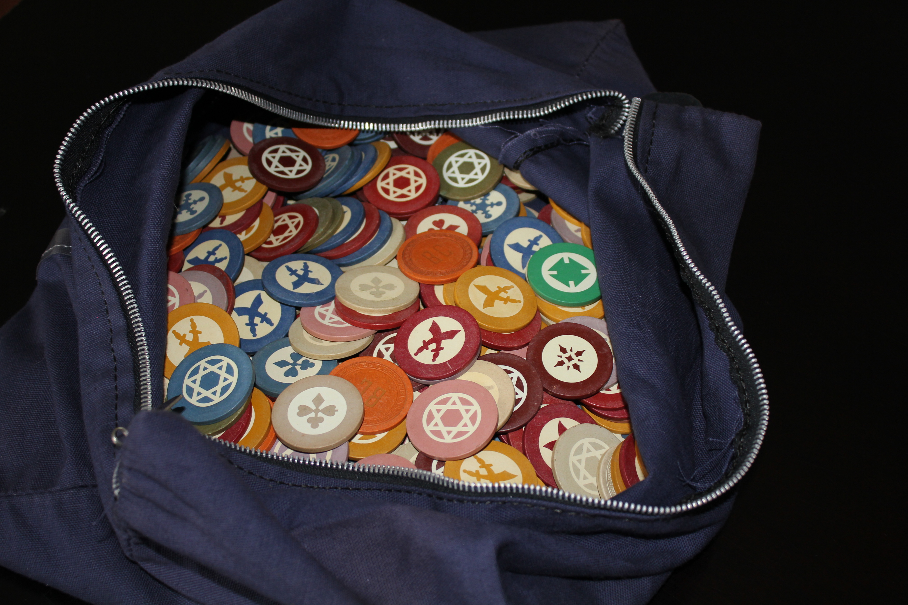 a bag full of colorful tokens