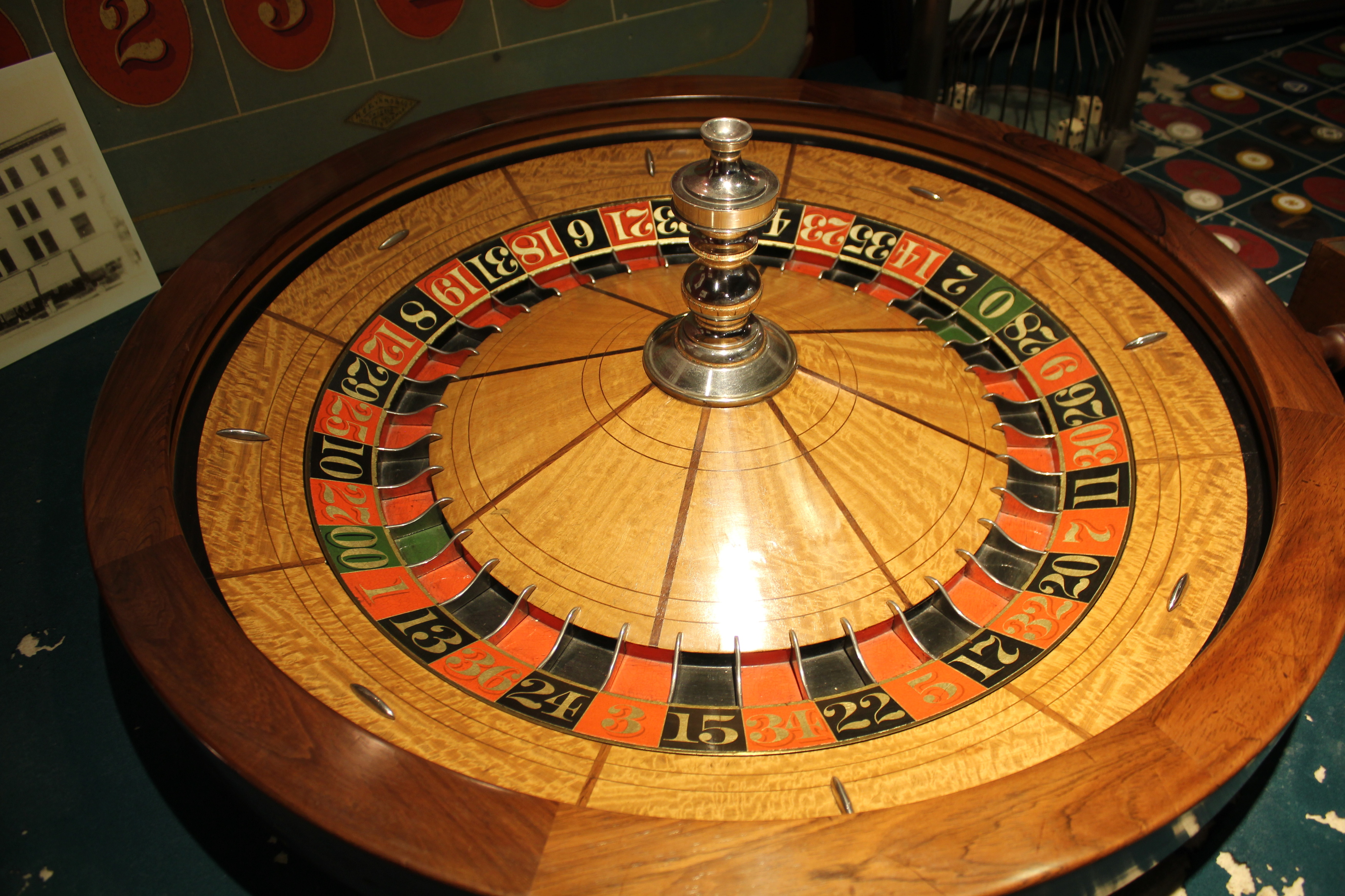 a roulette wheel with a ball on top