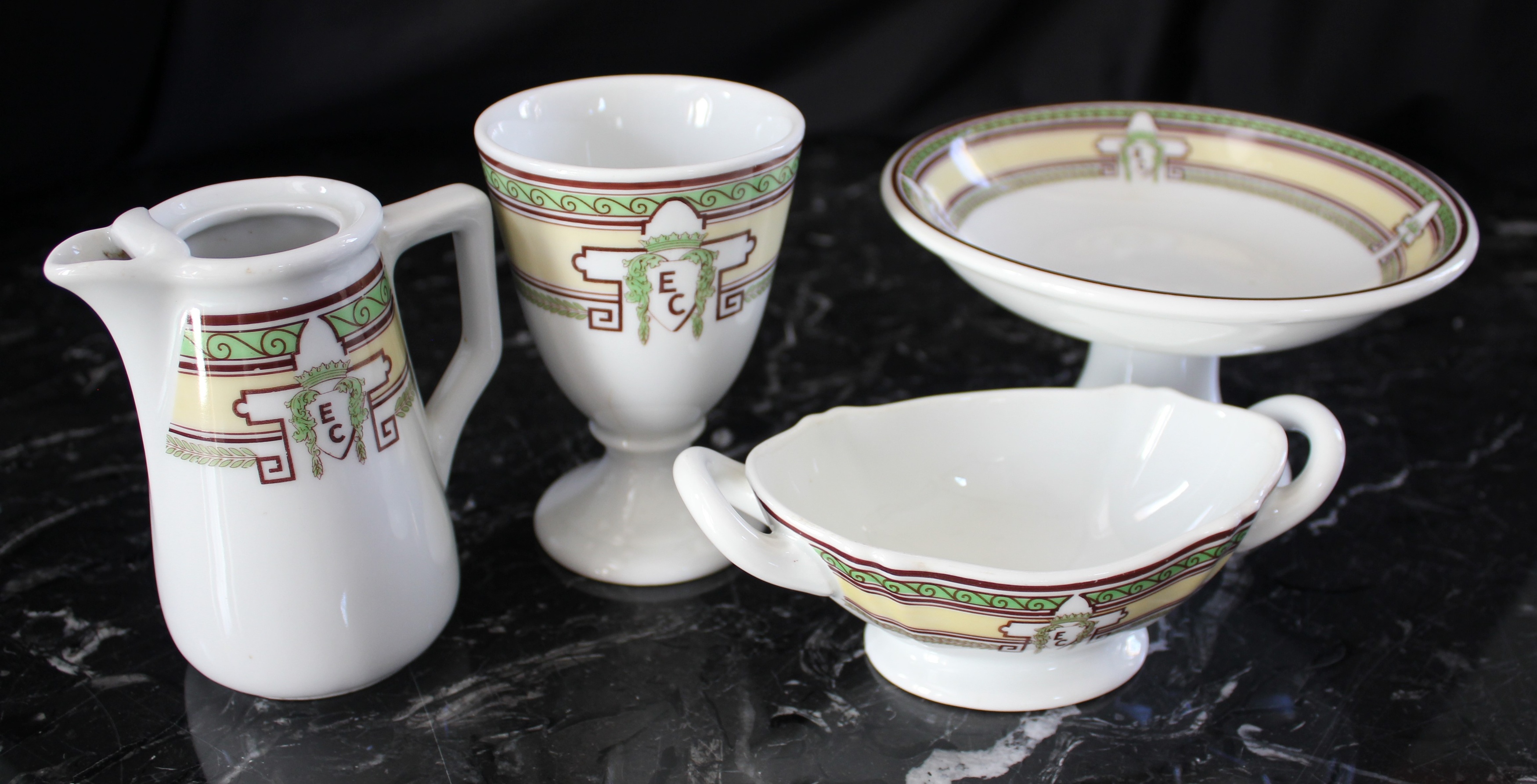 a group of tea cups and saucers