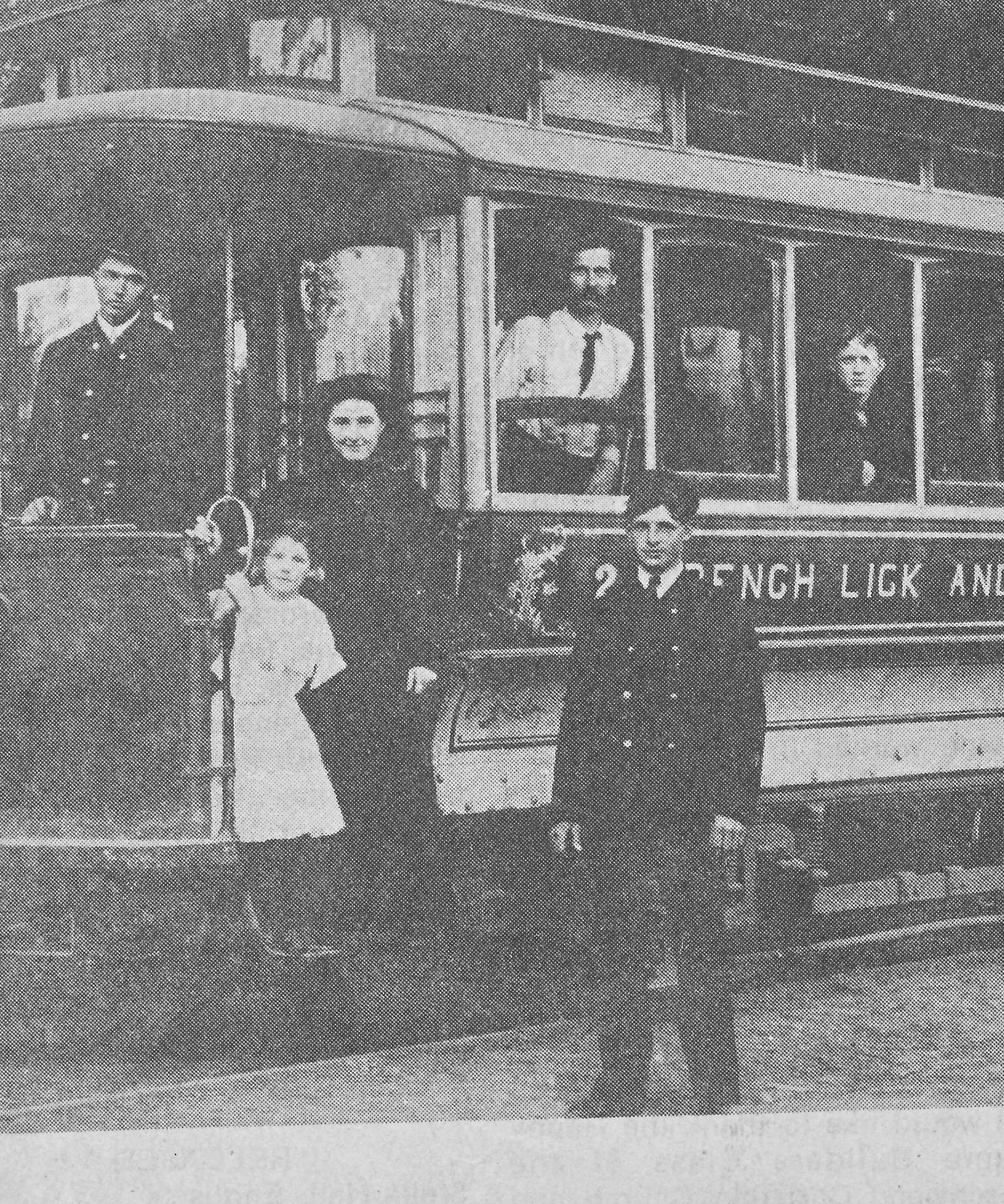 a group of people standing on a trolley