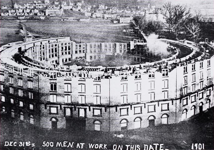 a building under construction with a train