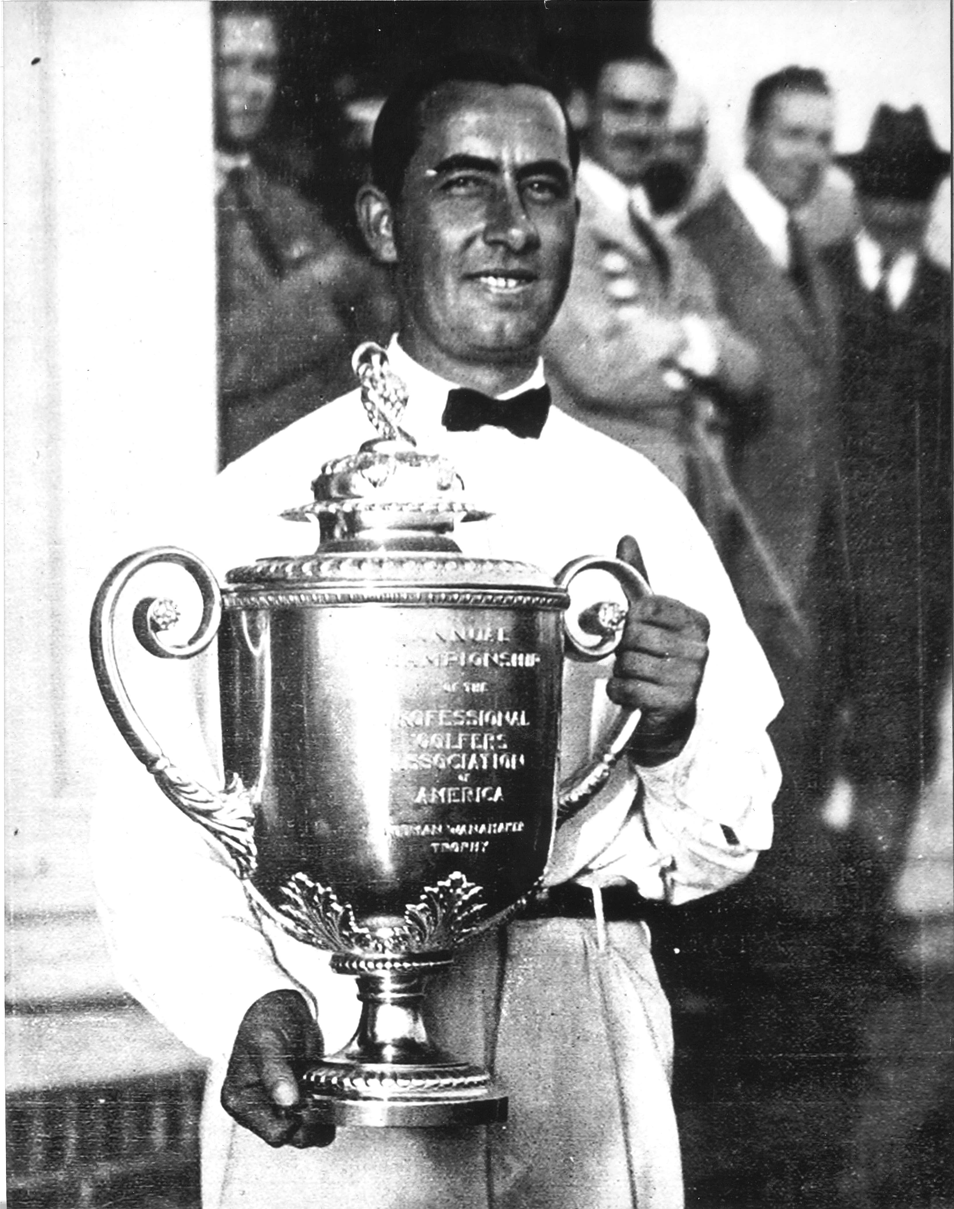 a man holding a trophy