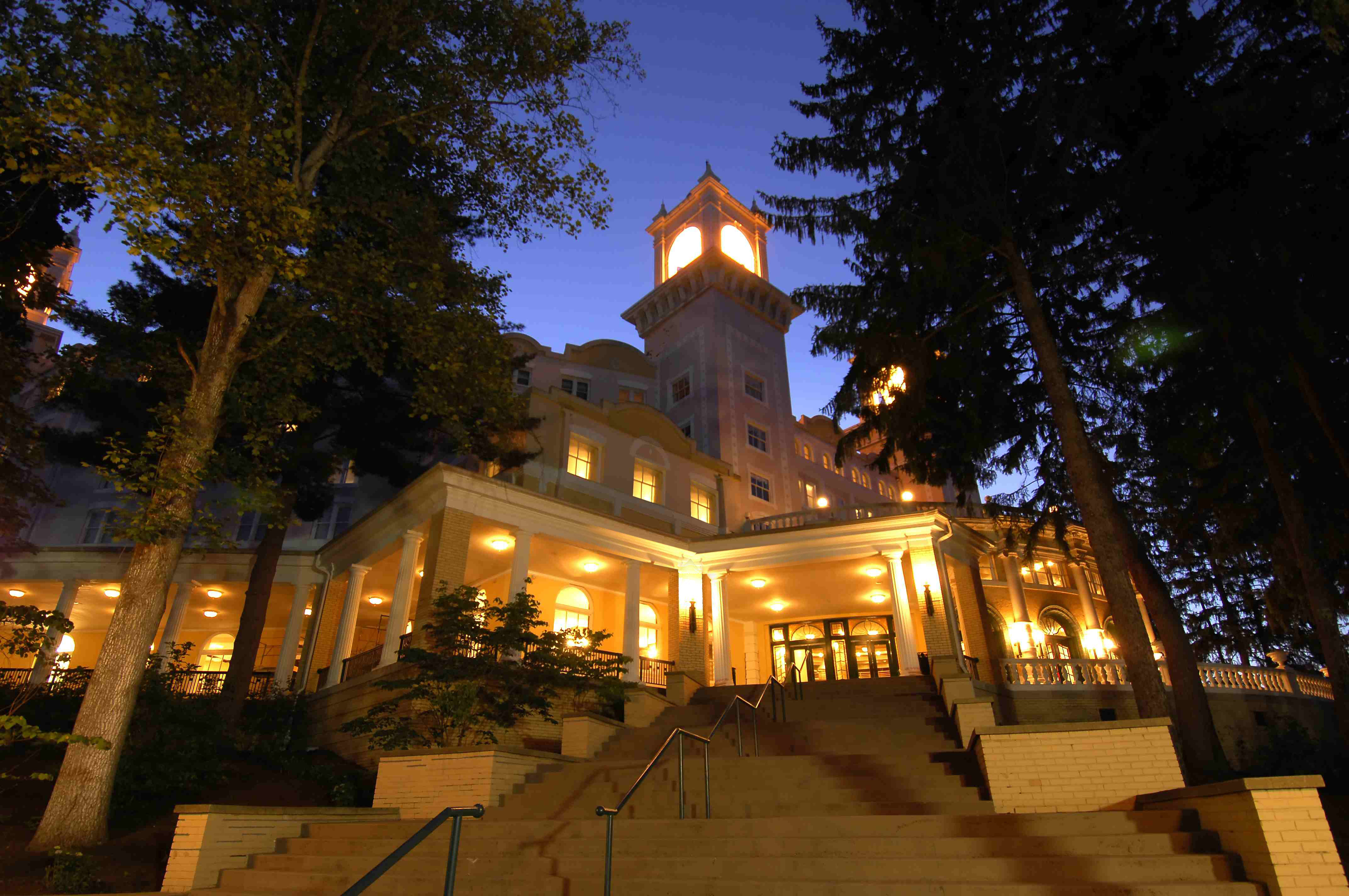 a building with a tower and stairs leading to it