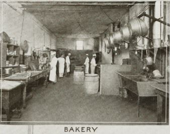 a group of people in a bakery