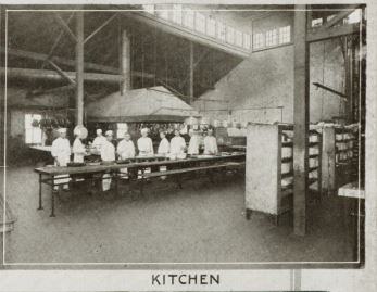 a group of people in a kitchen