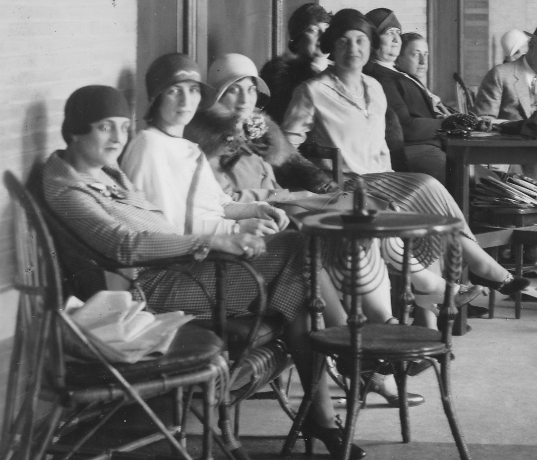 a group of women sitting in chairs